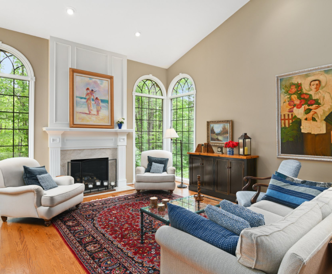 Living room with fireplace and arched windows