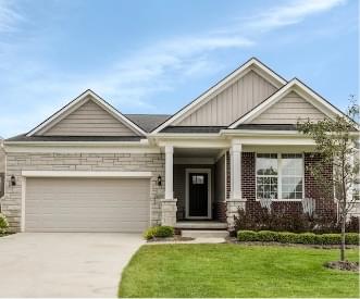 house with garage and green lawn