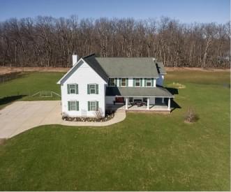 aerial view of home with a large yard